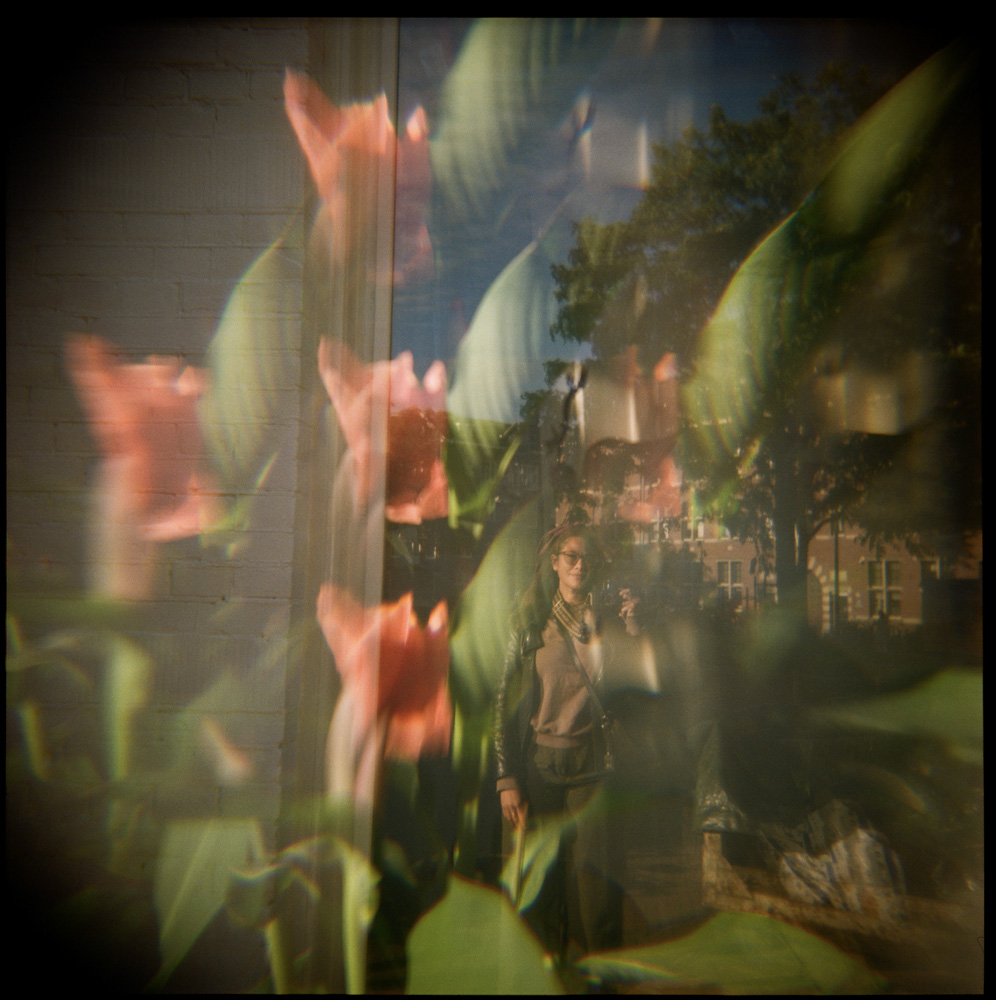 Reflection self-portrait with prisms and flowers 